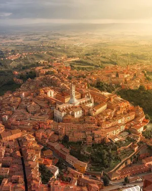 Aerial Shot Of Medieval Brick Buildings In Siena Wallpaper