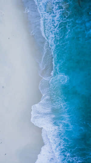 Aerial_ View_ Crystal_ Blue_ Waves_ Beach_4 K_ U H D.jpg Wallpaper