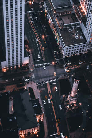 Aerial View Of A City At Night Wallpaper