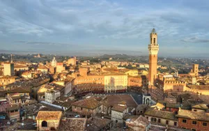 Aerial View Of Brick Buildings In Siena Wallpaper