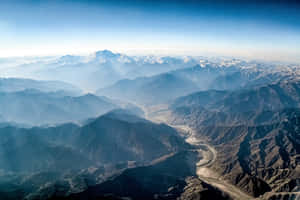 Aerial_ View_of_ Mountain_ Ranges_and_ River_ Valley Wallpaper