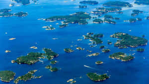 Aerial_ View_of_ Scattered_ Islands_ Archipelago Wallpaper