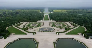 Aerial View Of The Majestic Palace Of Versailles Wallpaper