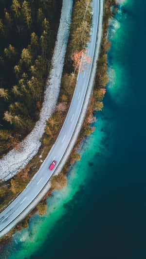 Aerial View Red Car Coastal Road Wallpaper