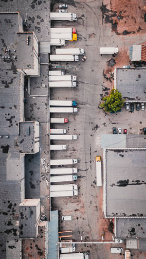 Aerial View Trucks At Factory Wallpaper