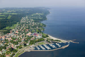 Aerial Viewof Coastal Townand Marina Wallpaper