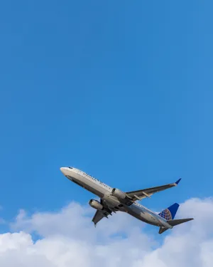 Aeroplane Cloudy Blue Sky Wallpaper
