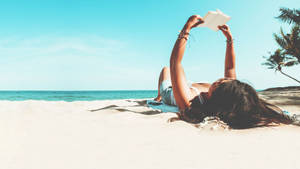 Aesthetic Beach Woman On The Sand Wallpaper