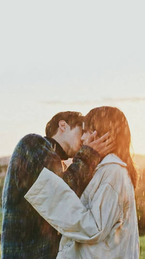 Aesthetic Couple Kissing In Rain Wallpaper