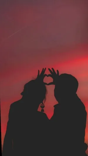 Aesthetic Couple With Red Sky Wallpaper