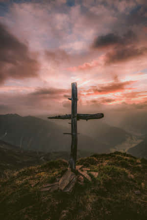 Aesthetic Cross Illuminated In The Night Sky Wallpaper