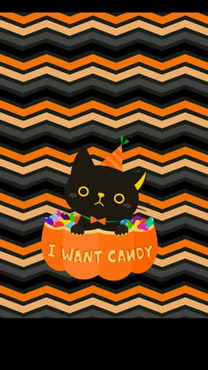 Aesthetic Cute Halloween Black Cat In A Pumpkin Wallpaper