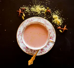 Aesthetic Pink Tea With Rose Petals Wallpaper