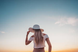 Aesthetic Sky In Front Of Woman Wallpaper