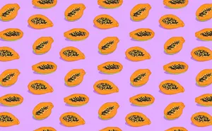 Aesthetic Sliced Papaya Fruits Purple Background Wallpaper
