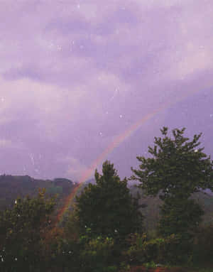 Aesthetic Vintage Purple Sky And Rainbow Wallpaper