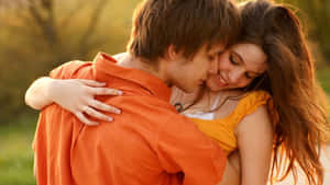 Affectionate Couple Embrace Outdoors.jpg Wallpaper