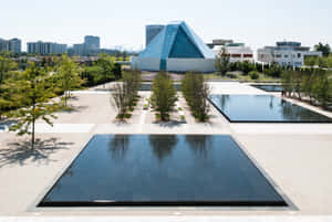 Aga Khan Museum Exterior Viewwith Reflecting Pools Wallpaper