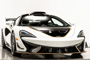 Aggressive And Stylish Mclaren 620r On The Road Wallpaper