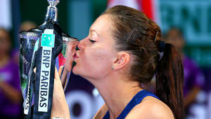 Agnieszka Radwanska Kissing Trophy Side Profile Wallpaper