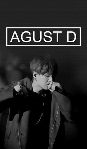 Agust D Exuding Style And Passion In A Striking Portrait Wallpaper