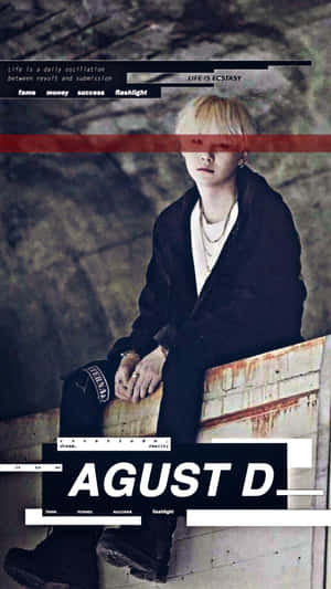 Agust D Leaning On Grey Wall Wallpaper