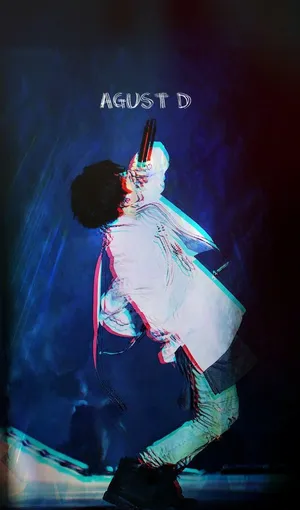 Agust D Performing On Stage Wallpaper