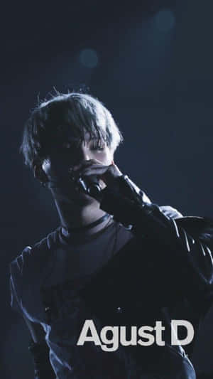 Agust D Striking A Confident Pose In Grayscale Wallpaper