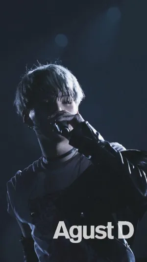 Agust D Striking A Confident Pose In Grayscale Wallpaper