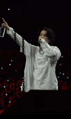 Agust D Striking A Pose In A Captivating Black And White Photo Wallpaper