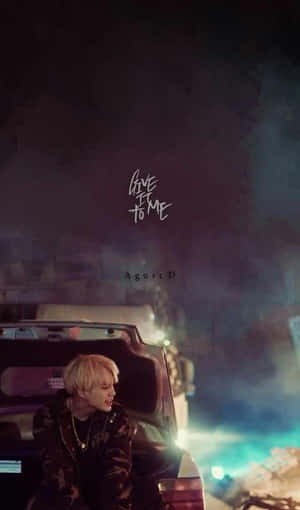 Agust D Striking A Thoughtful Pose Wallpaper