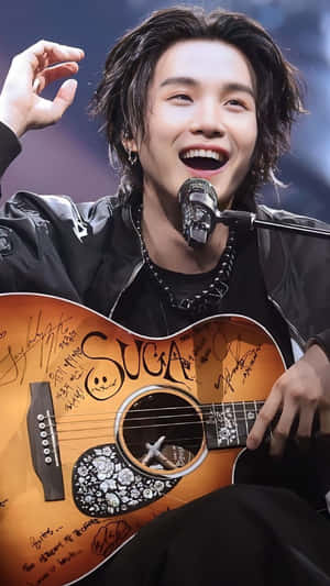 Agust D - The Fierce And Powerful Rapper Dominating The Stage Wallpaper