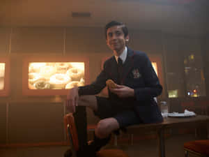 Aidan Gallagher Posing In Film Studio Wallpaper