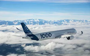 Airbus A350 Over Cloudsand Mountains Wallpaper