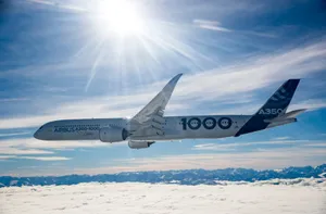 Airbus A3501000 Midflight Over Mountains Wallpaper