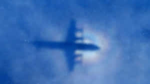 Airplane_ Shadow_on_ Clouds Wallpaper