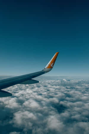 Airplane_ Wing_ Over_ Clouds Wallpaper