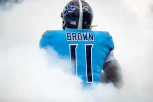 Aj Brown Walking Through Smoke Wallpaper