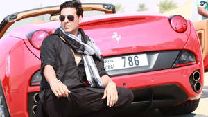 Akshay Kumar With Red Ferrari Car Wallpaper