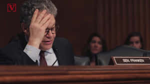 Al Franken Delivering Speech On Stage Wallpaper