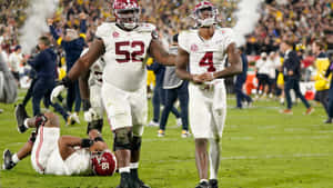 Alabama Football Players Walking Off Field Wallpaper