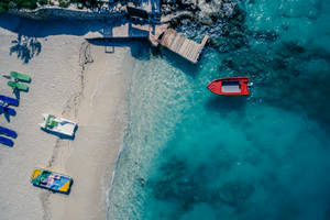 Albania Beach Red Boat Wallpaper