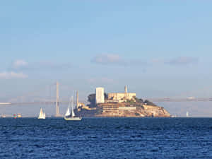 Alcatraz Islandwith Sailboatsand Bay Bridge Wallpaper