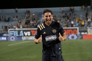 Alejandro Bedoya Giving A Thumbs-up Sign Wallpaper