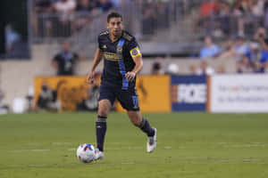 Alejandro Bedoya Running With Ball Wallpaper