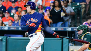 Alex Bregman In Blue And Orange Astros Uniform Wallpaper