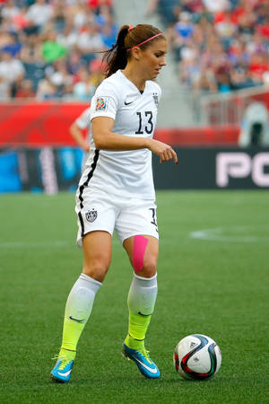 Alex Morgan In Soccer Field Wallpaper