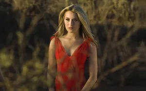 Alexa Penavega Posing Gracefully In Front Of A Beautiful Background Wallpaper