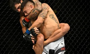 Alexandre Pantoja Arm Around Opponents Head Wallpaper