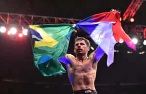 Alexandre Pantoja Holding Flags Wallpaper